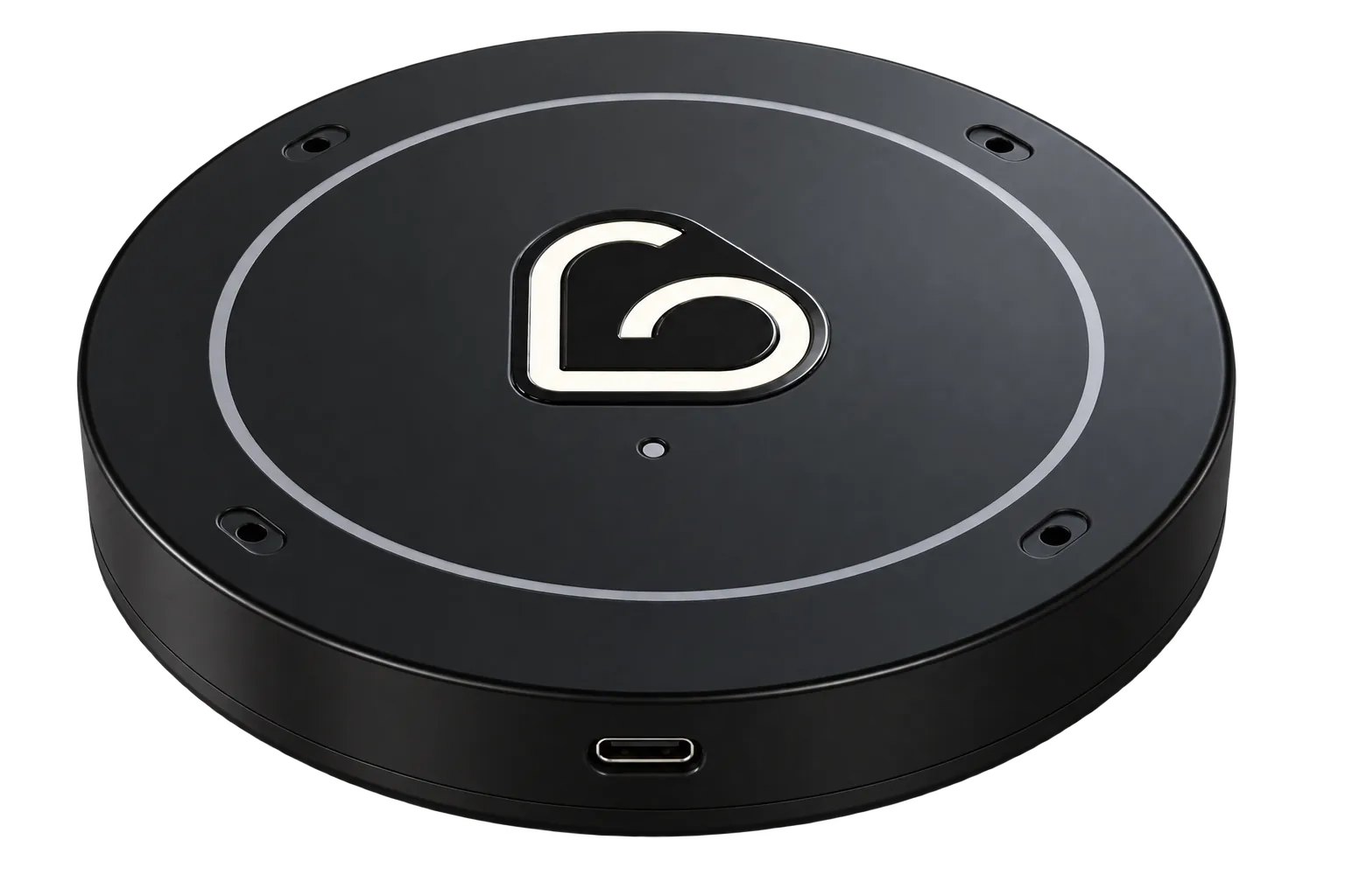 The Lovely device: a small, round, matte-black puck with a softly lit heart-spiral mark and a USB-C port